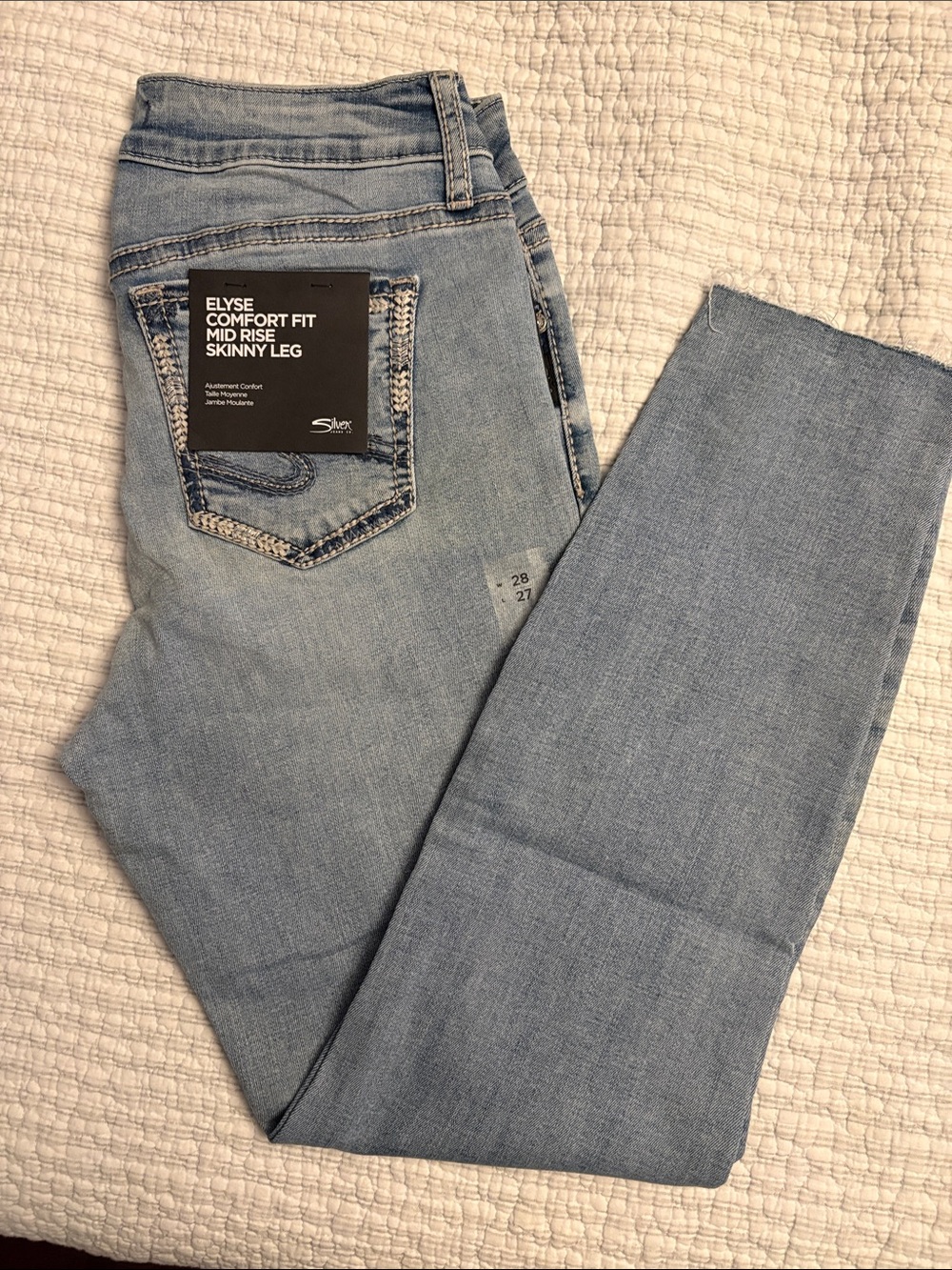 Silver Jeans Elyse Mid-Rise Skinny Jeans in Light Wash Blue